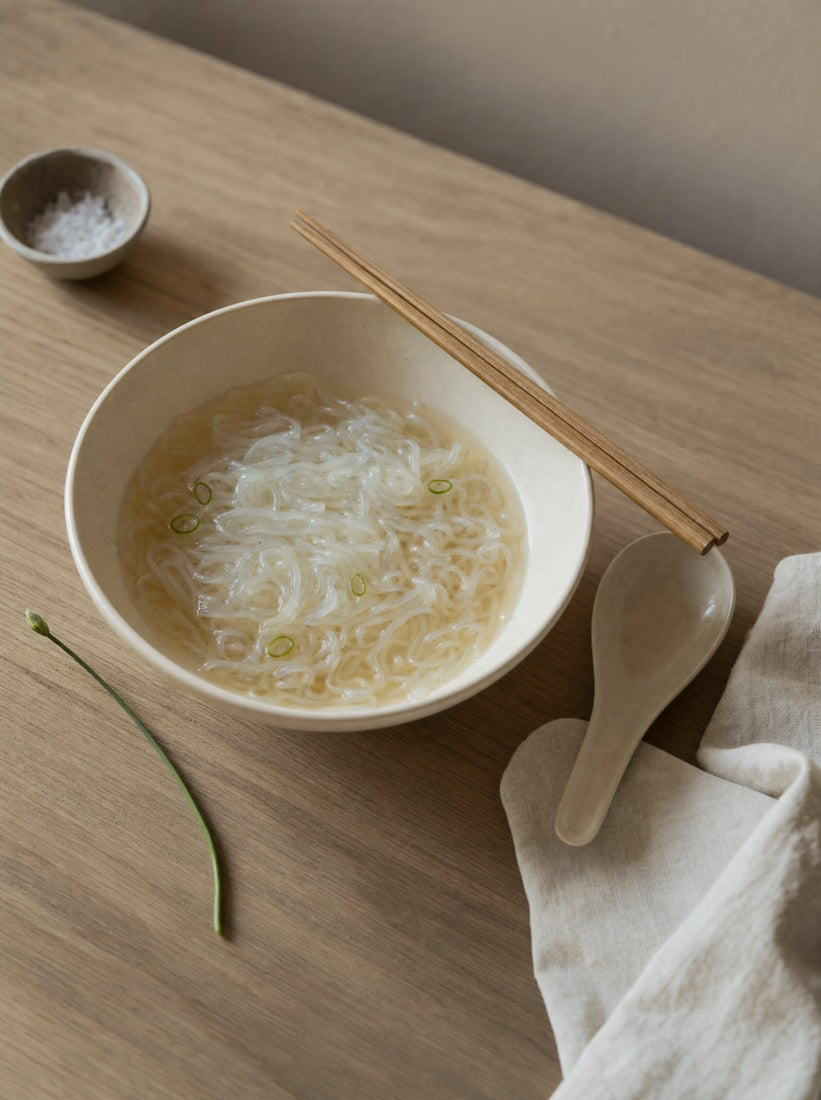 A gentle evening bowl of konjac noodles in light broth with scallions
