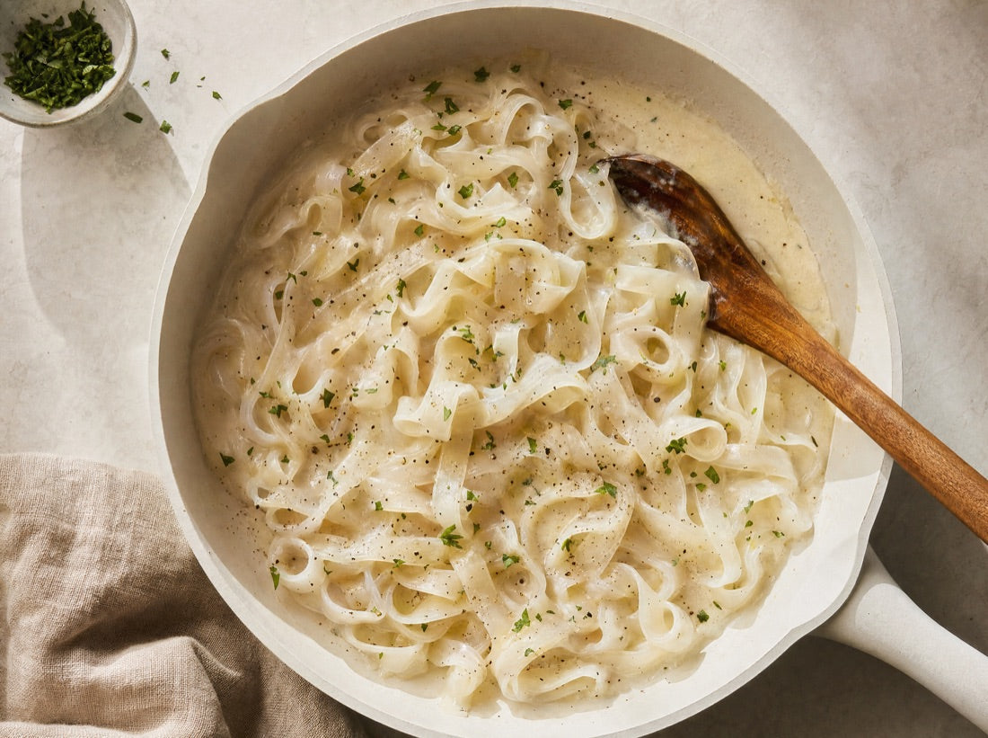 Noodles cooking in a pan